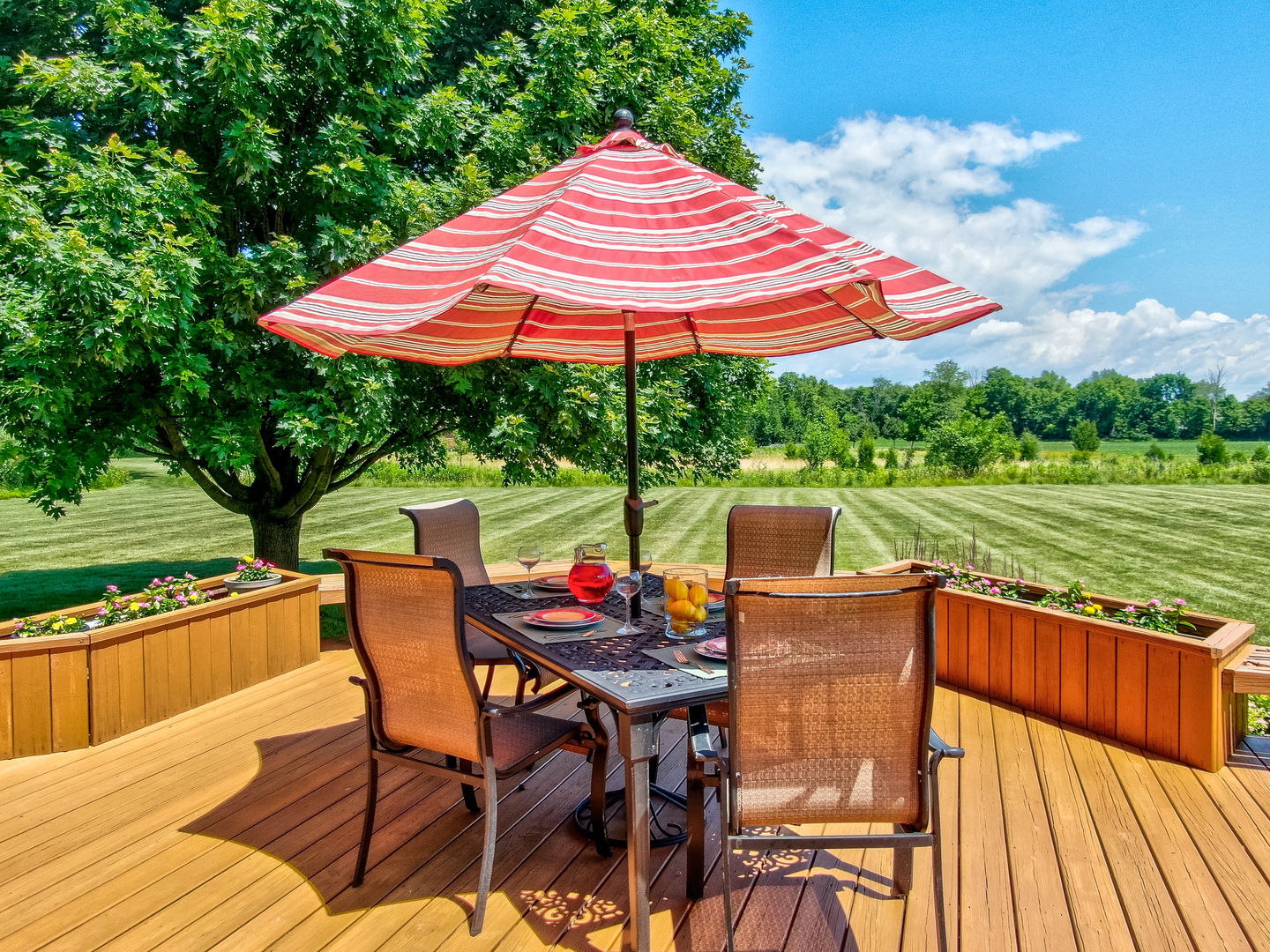 2656 East 1559th Road Ottawa, IL 61350 - Photo 12 of 49 a patio with a table and chairs under an umbrella