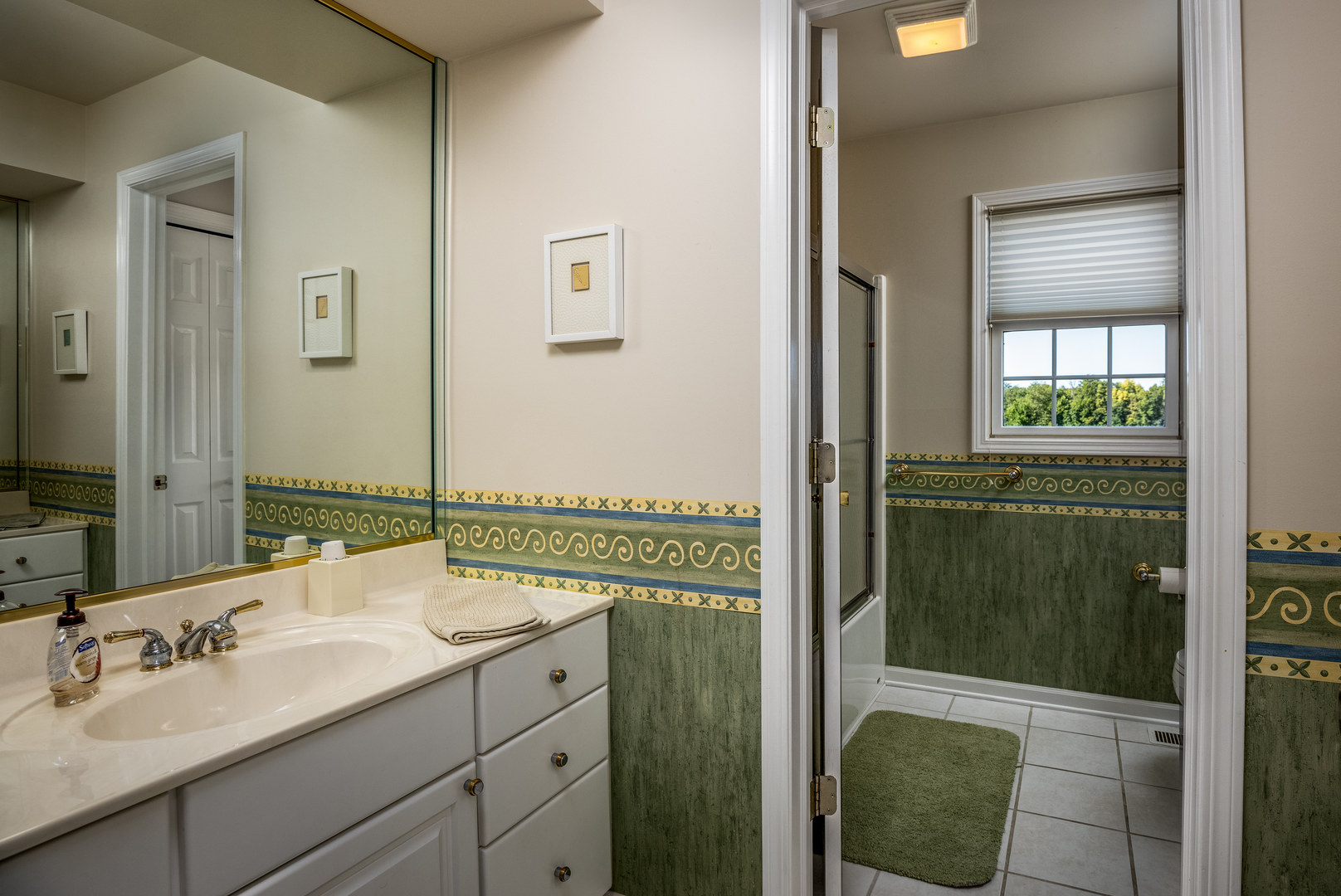 2656 East 1559th Road Ottawa, IL 61350 - Photo 39 of 49 a bathroom with a shower sink and mirror