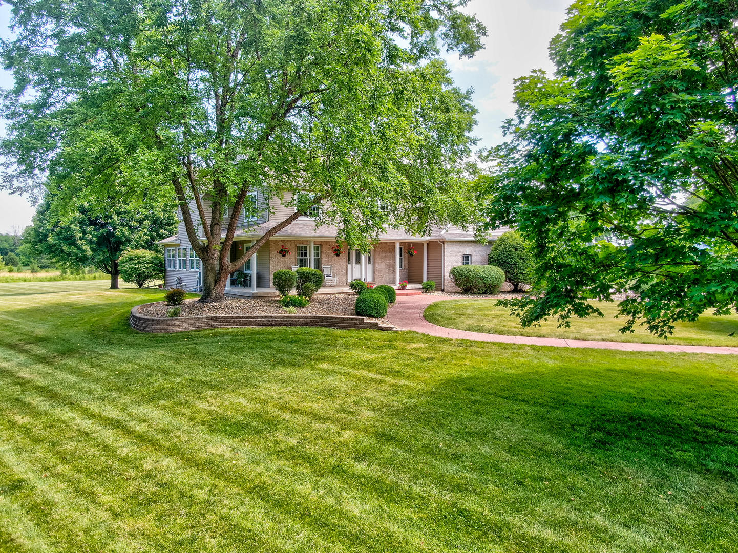 2656 East 1559th Road Ottawa, IL 61350 - Photo 9 of 49 a front view of a house with garden and trees