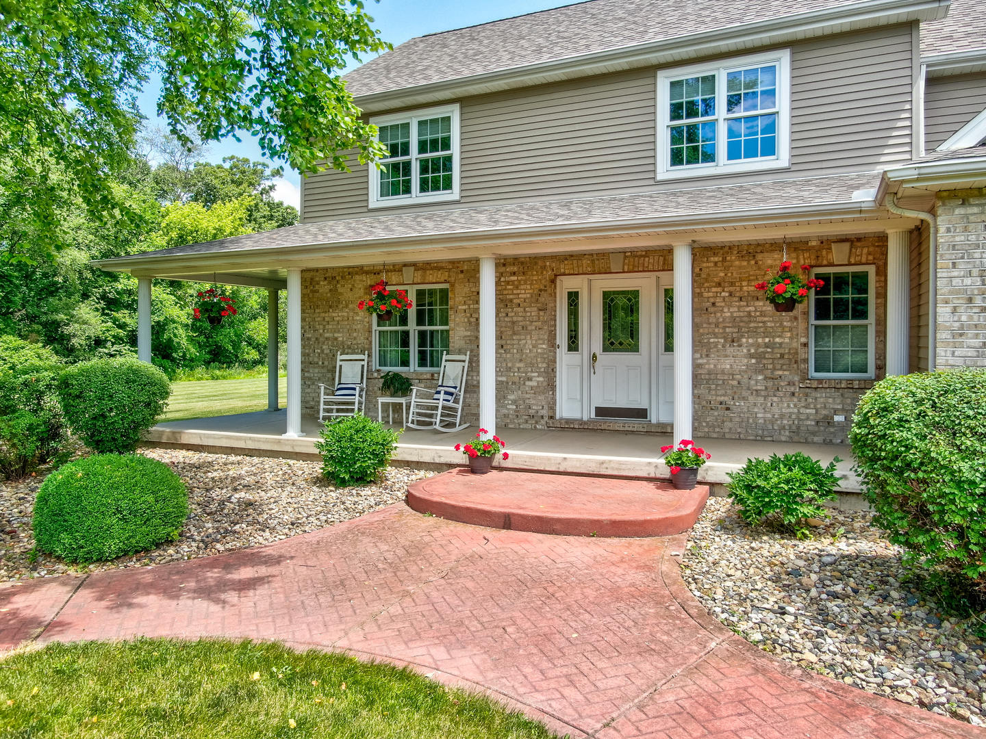2656 East 1559th Road Ottawa, IL 61350 - Photo 10 of 49 a front view of a house with porch and garden