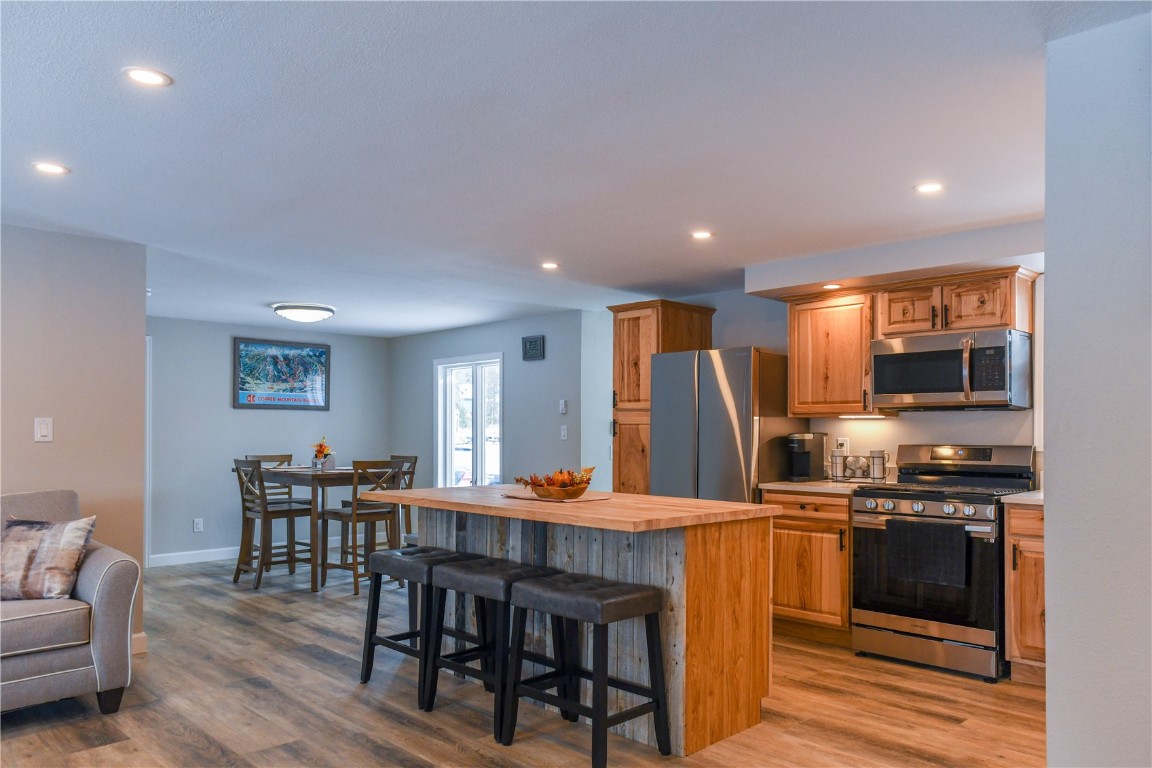 452 Cascade Circle Silverthorne, CO 80498 - Photo 11 of 35 a open kitchen with stainless steel appliances granite countertop a stove and a dining table