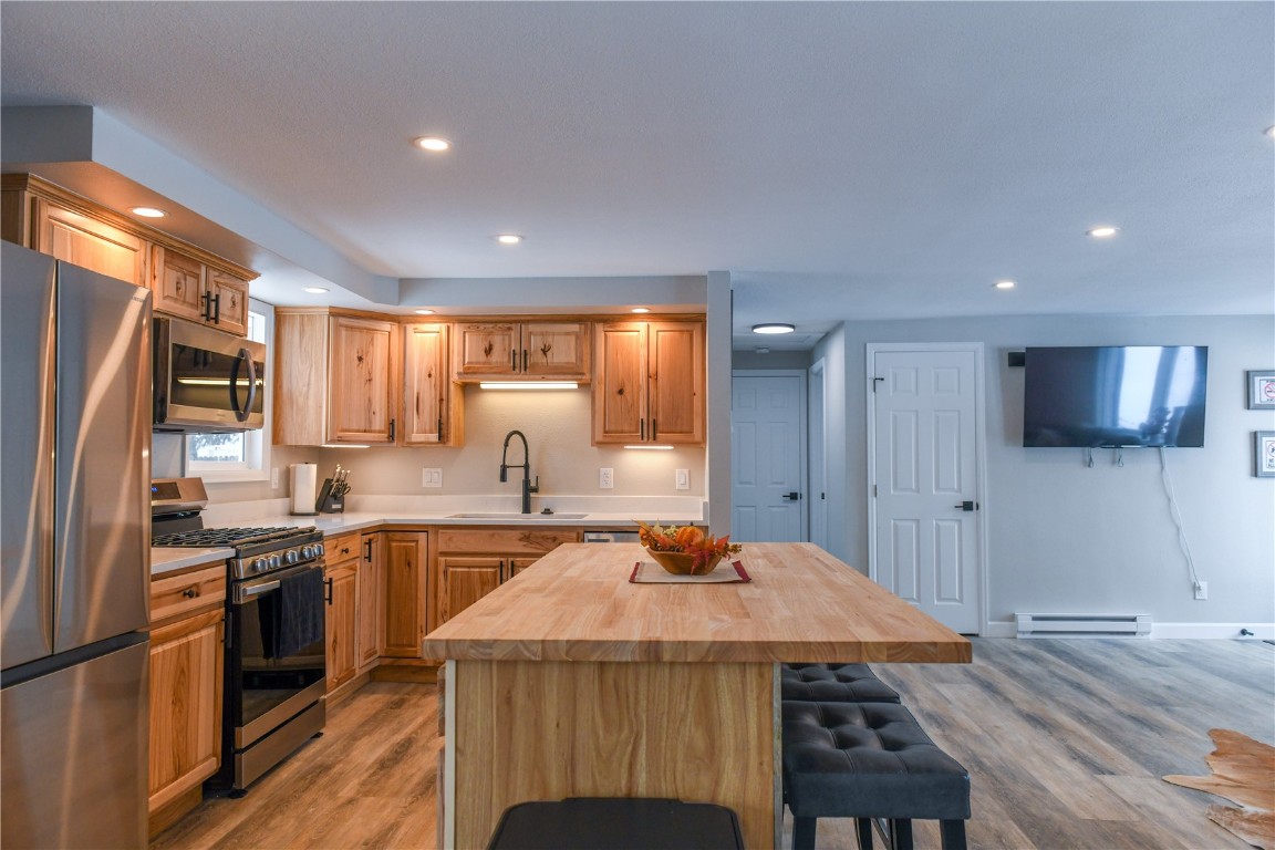 452 Cascade Circle Silverthorne, CO 80498 - Photo 13 of 35 a kitchen with stainless steel appliances granite countertop a sink stove and refrigerator