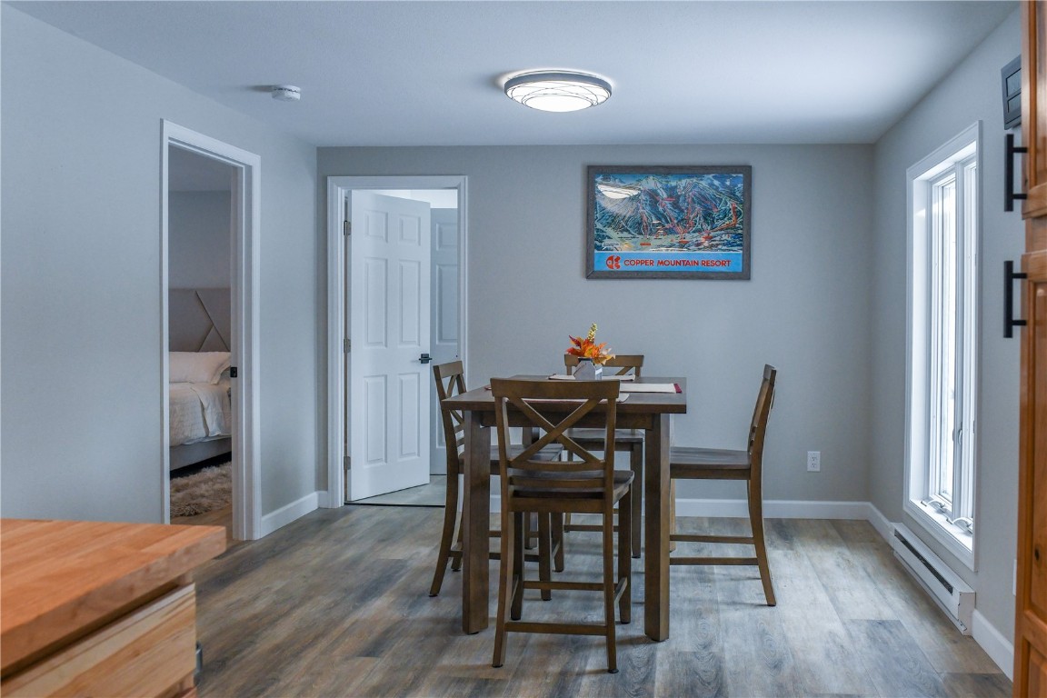 452 Cascade Circle Silverthorne, CO 80498 - Photo 15 of 35 a view of a dining room with furniture and wooden floor