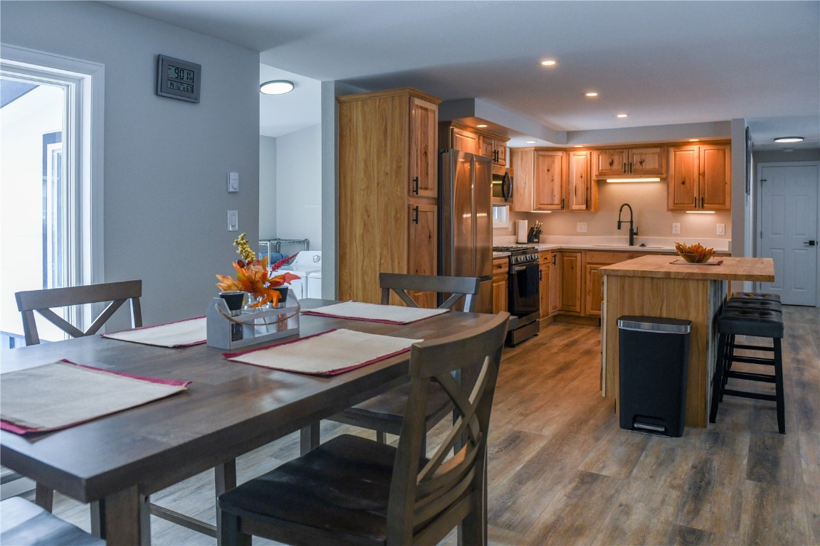 452 Cascade Circle Silverthorne, CO 80498 - Photo 17 of 35 a view of a dining room with furniture window and wooden floor