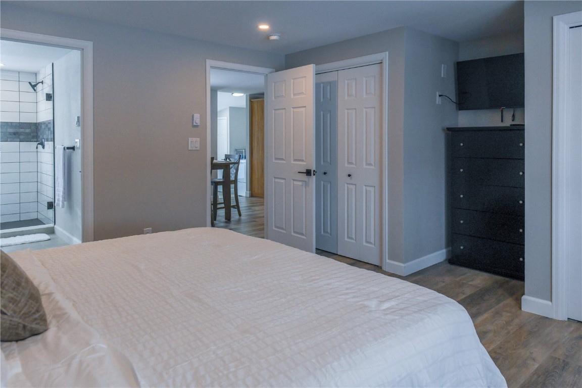 452 Cascade Circle Silverthorne, CO 80498 - Photo 19 of 35 a bedroom with a bed and cabinets