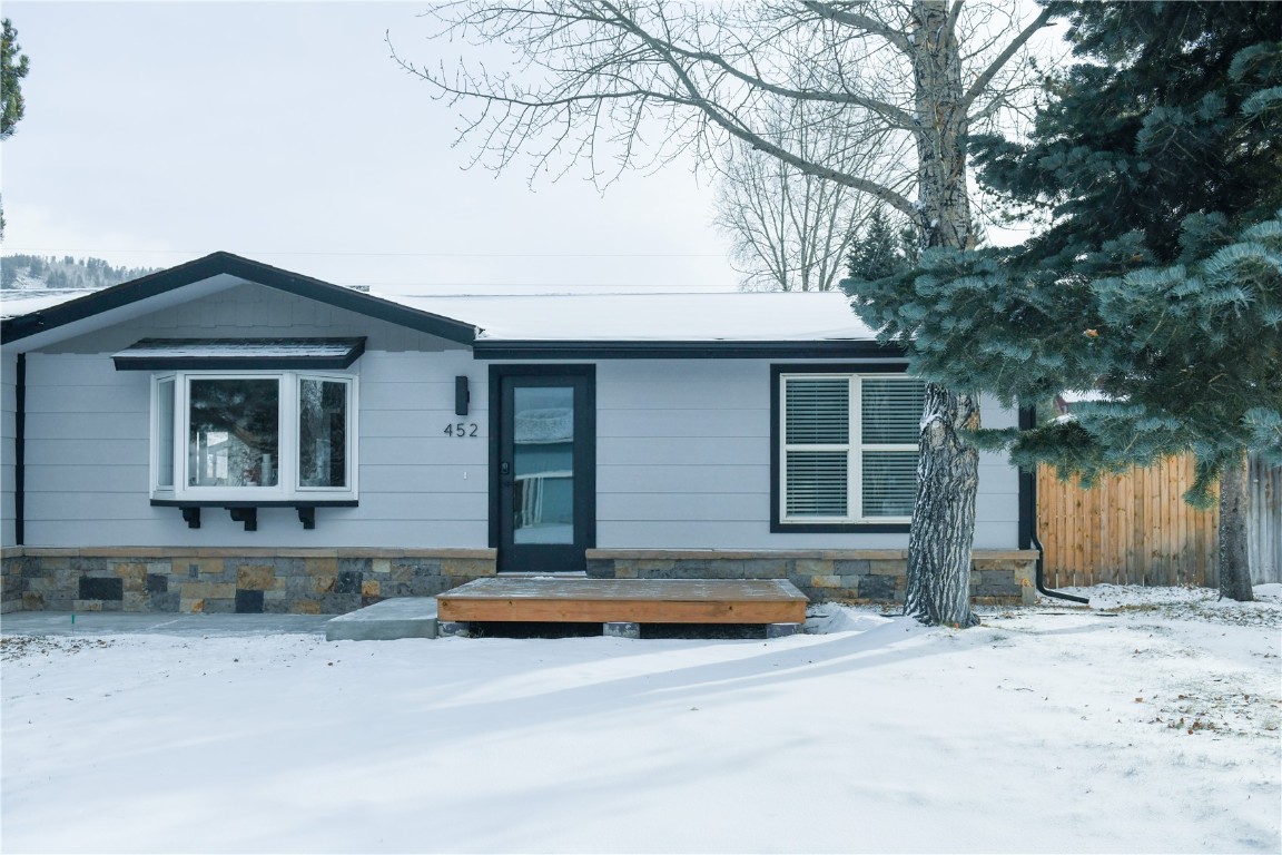 452 Cascade Circle Silverthorne, CO 80498 - Photo 2 of 35 a front view of a house with a yard and garage