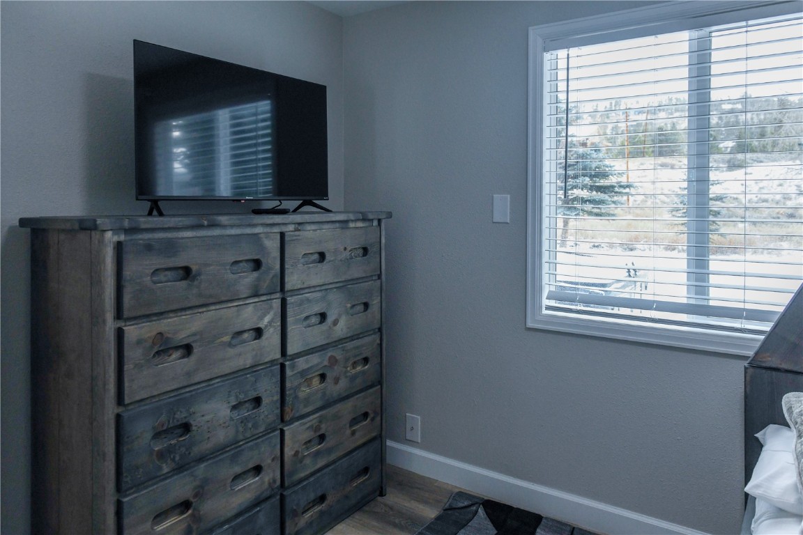 452 Cascade Circle Silverthorne, CO 80498 - Photo 26 of 35 a bathroom with a mirror and a flat screen tv