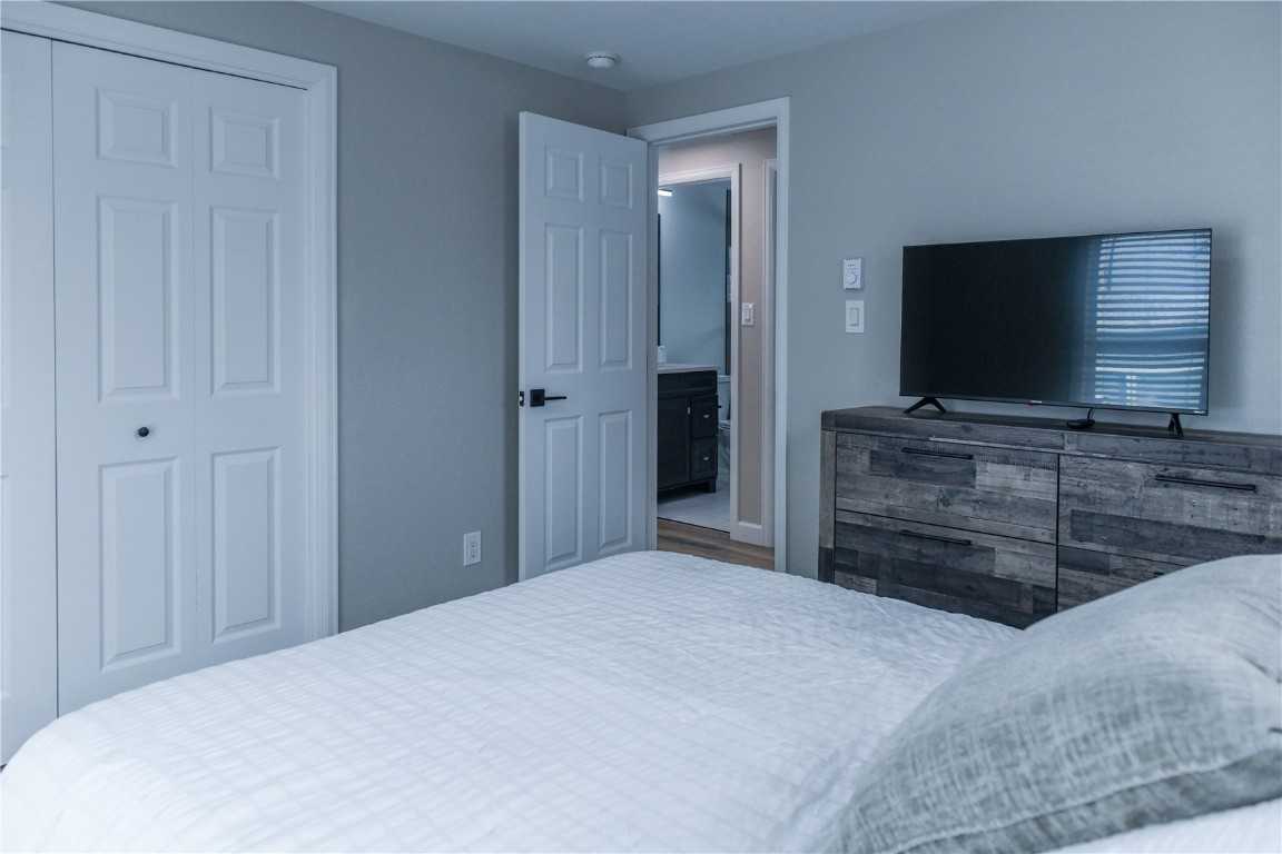 452 Cascade Circle Silverthorne, CO 80498 - Photo 28 of 35 a bedroom with a bed and a flat screen television