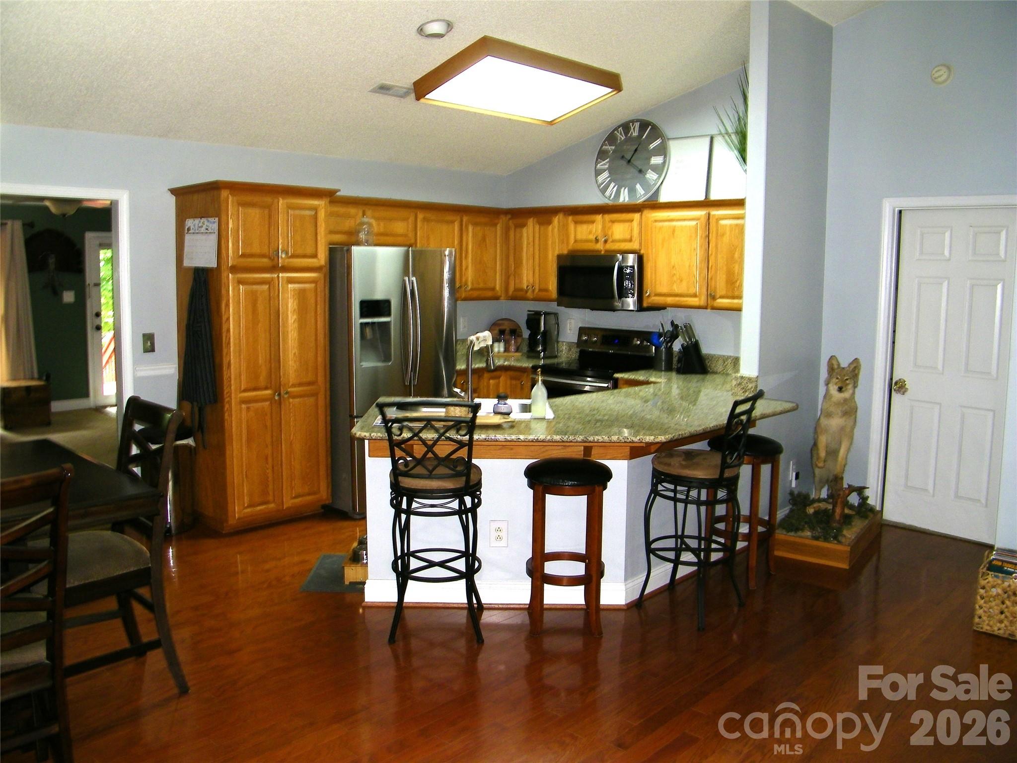609 Redah Avenue Locust, NC 28097 - Photo 3 of 37 a view of a dining room with furniture window and wooden floor