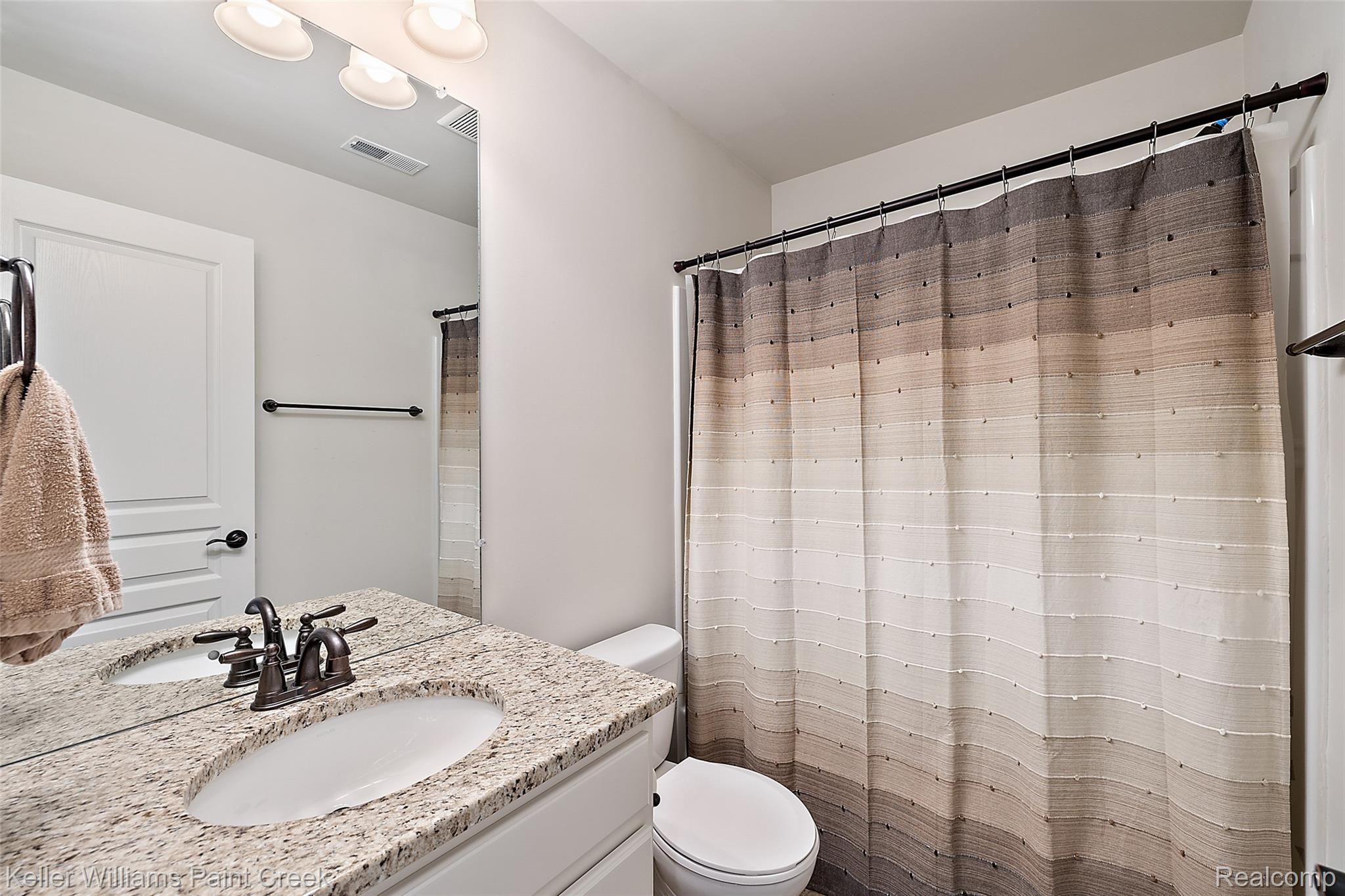 314 Glenhurst Boulevard Rochester, MI 48307 - Photo 35 of 64 Bathroom featuring vanity and a shower with shower curtain
