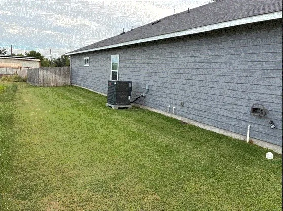 a view of a backyard with a table and chair