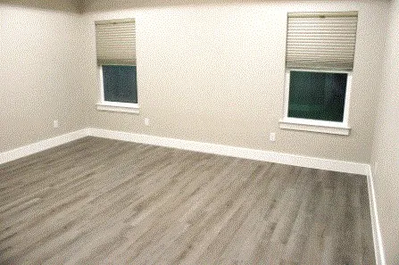 a bathroom with a light fixture and a ceiling fan