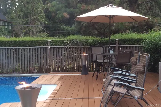 a view of a swimming pool with a patio