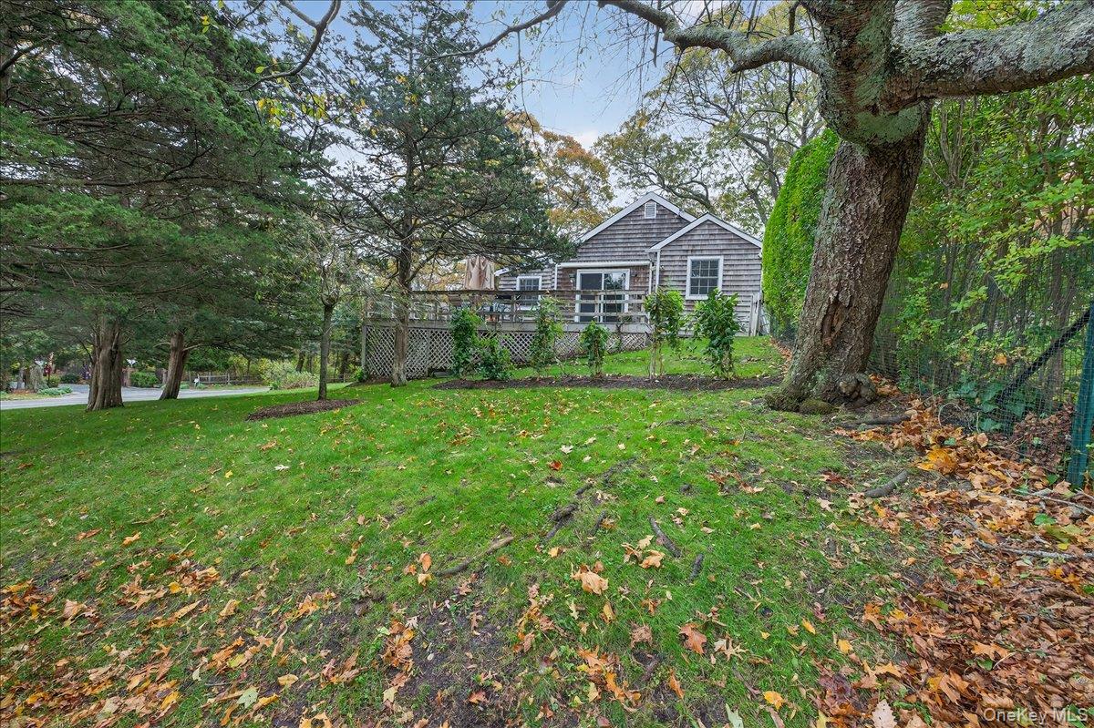 3748 Noyack Road Sag Harbor, NY 11963 - Photo 8 of 15 a front view of a house with garden