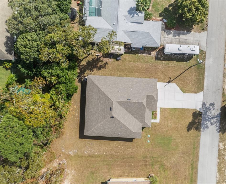 6283 Grapewood Road Spring Hill, FL 34609 - Photo 39 of 41 an aerial view of a house with a yard and wooden fence