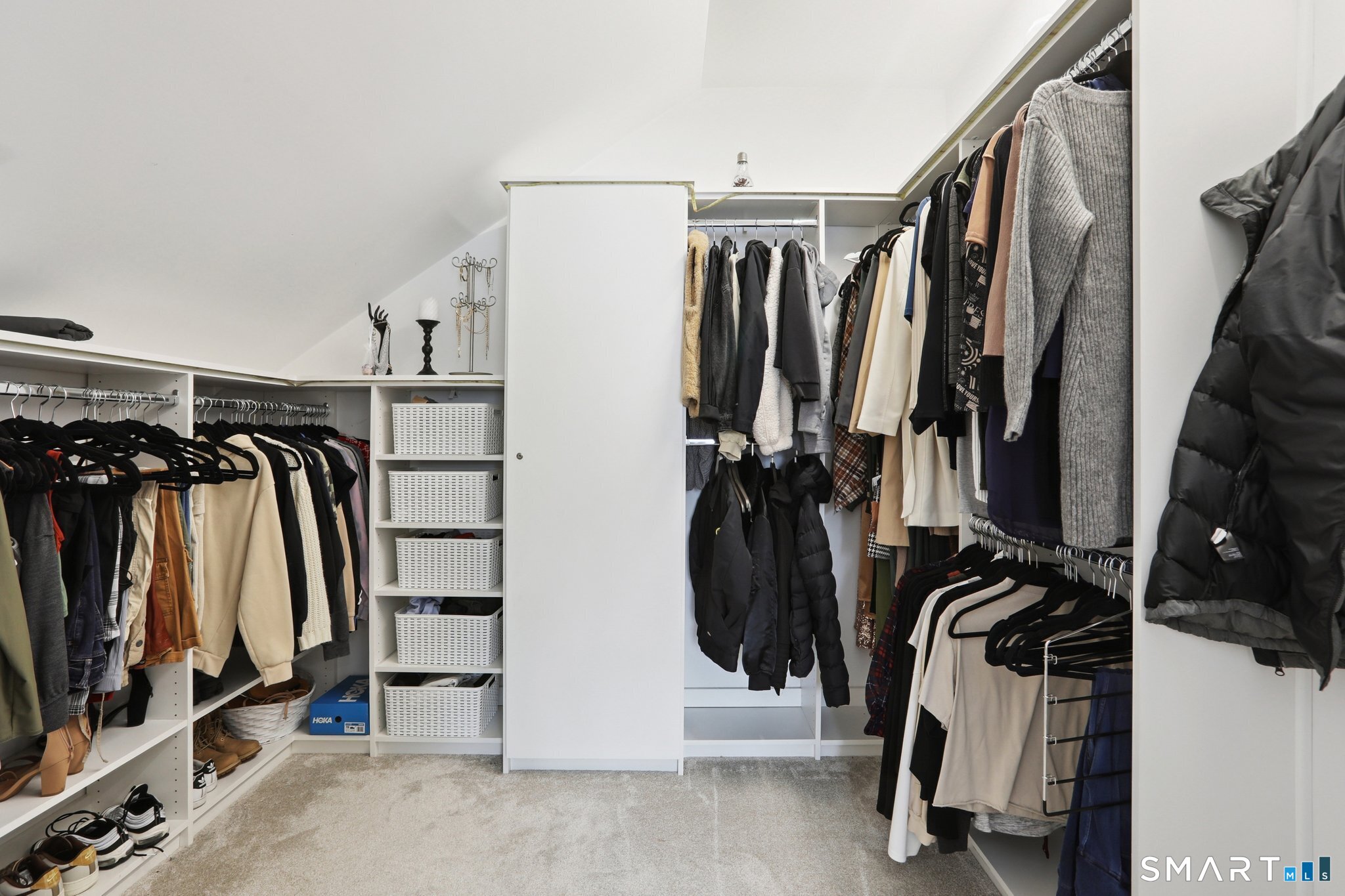 6 Ezra Road Danbury, CT 06811 - Photo 14 of 22 a view of walk in closet with clothes and shoes