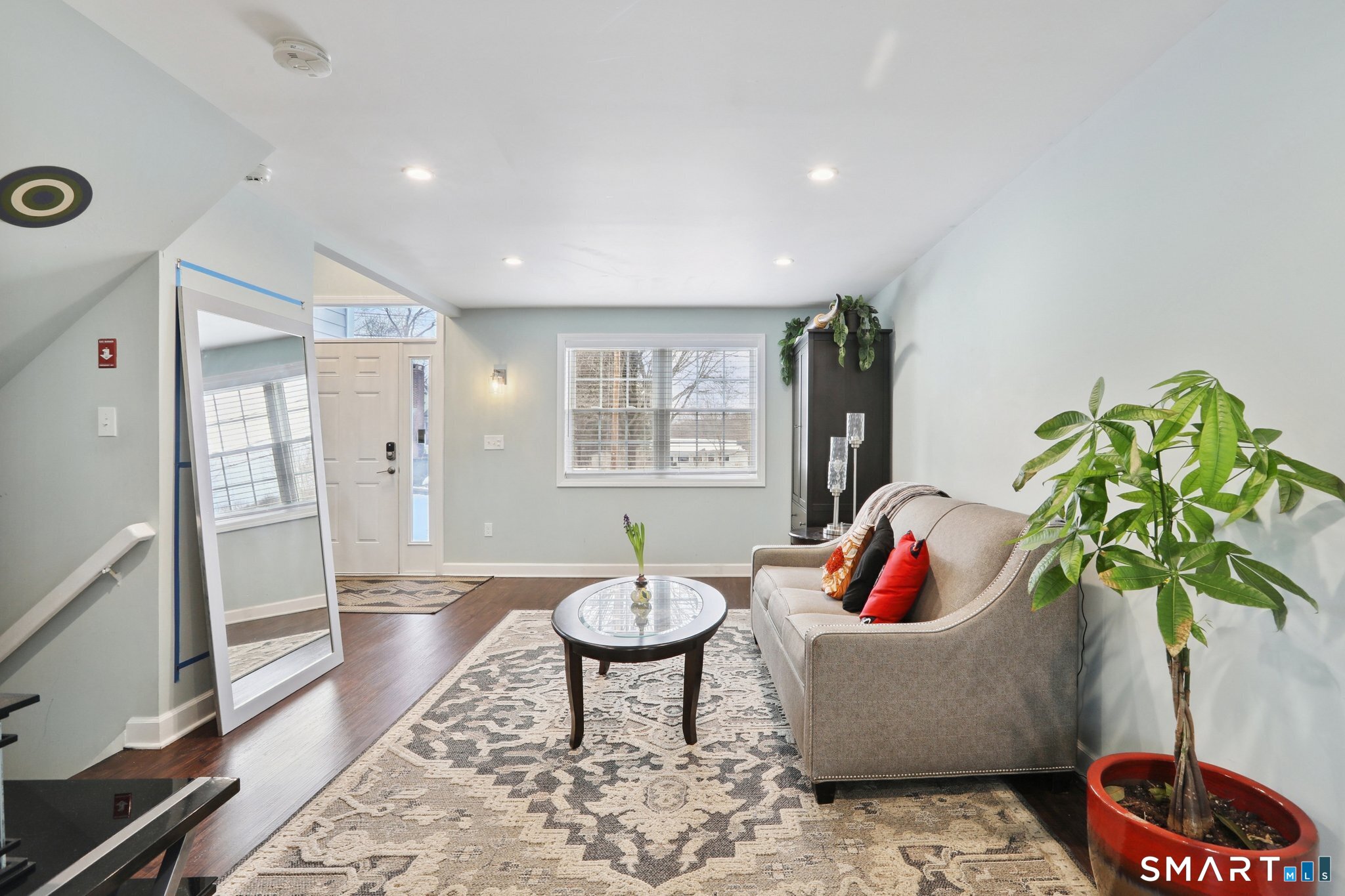 6 Ezra Road Danbury, CT 06811 - Photo 18 of 22 a living room with furniture and a potted plant