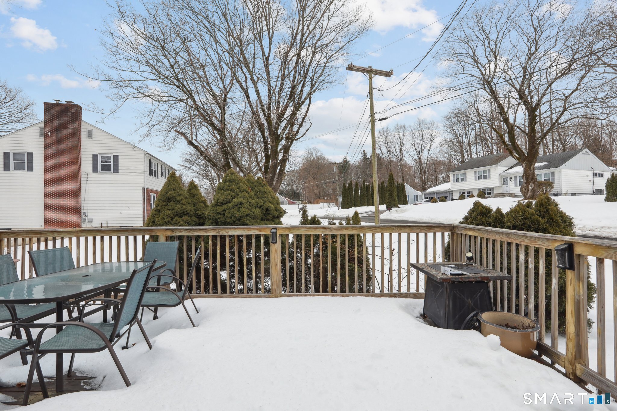 6 Ezra Road Danbury, CT 06811 - Photo 20 of 22 a view of a two chairs and table in the back yard of the house