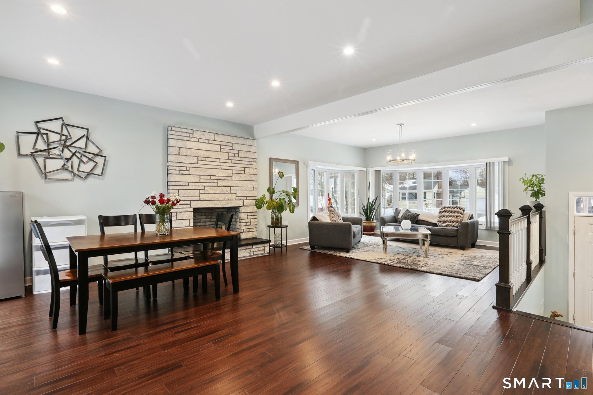 6 Ezra Road Danbury, CT 06811 - Photo 5 of 22 a living room with furniture wooden floor and a large window