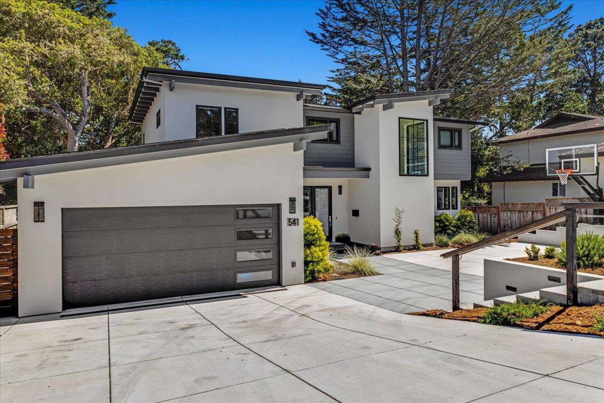a front view of a house with garage