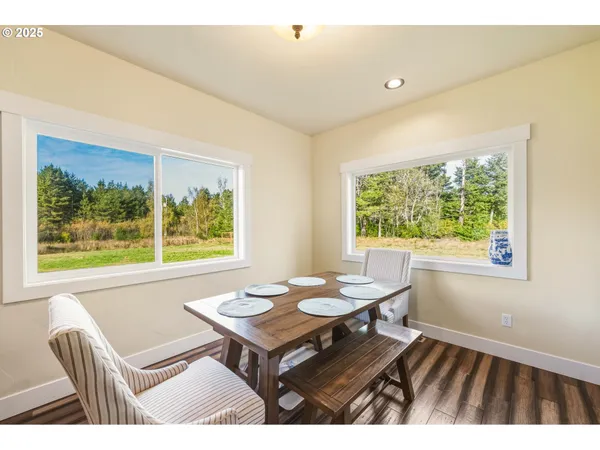 a outdoor dining room with furniture and window