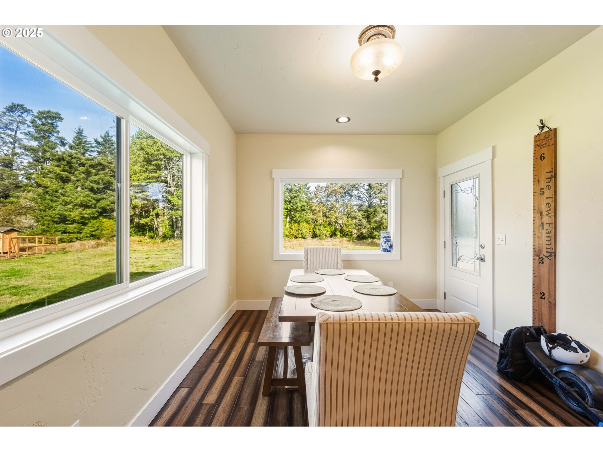 55942 Lost Valley Road Bandon, OR 97411 - Photo 13 of 48 a bedroom with a bed and a window