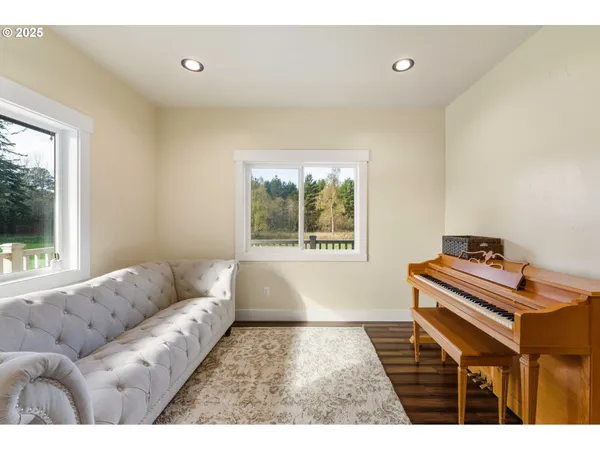 a living room with a couch and a window