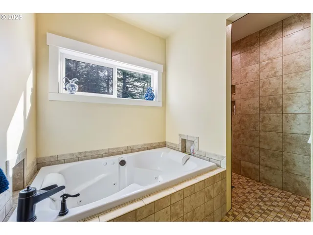 a bathroom with a tub and a sink