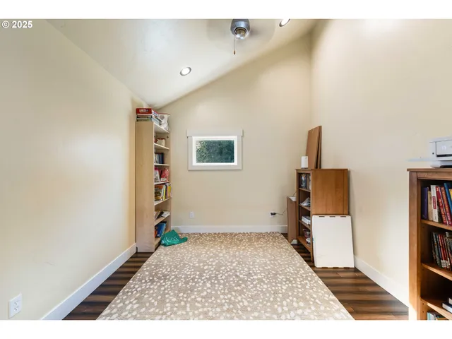 a view of an empty room and workspace