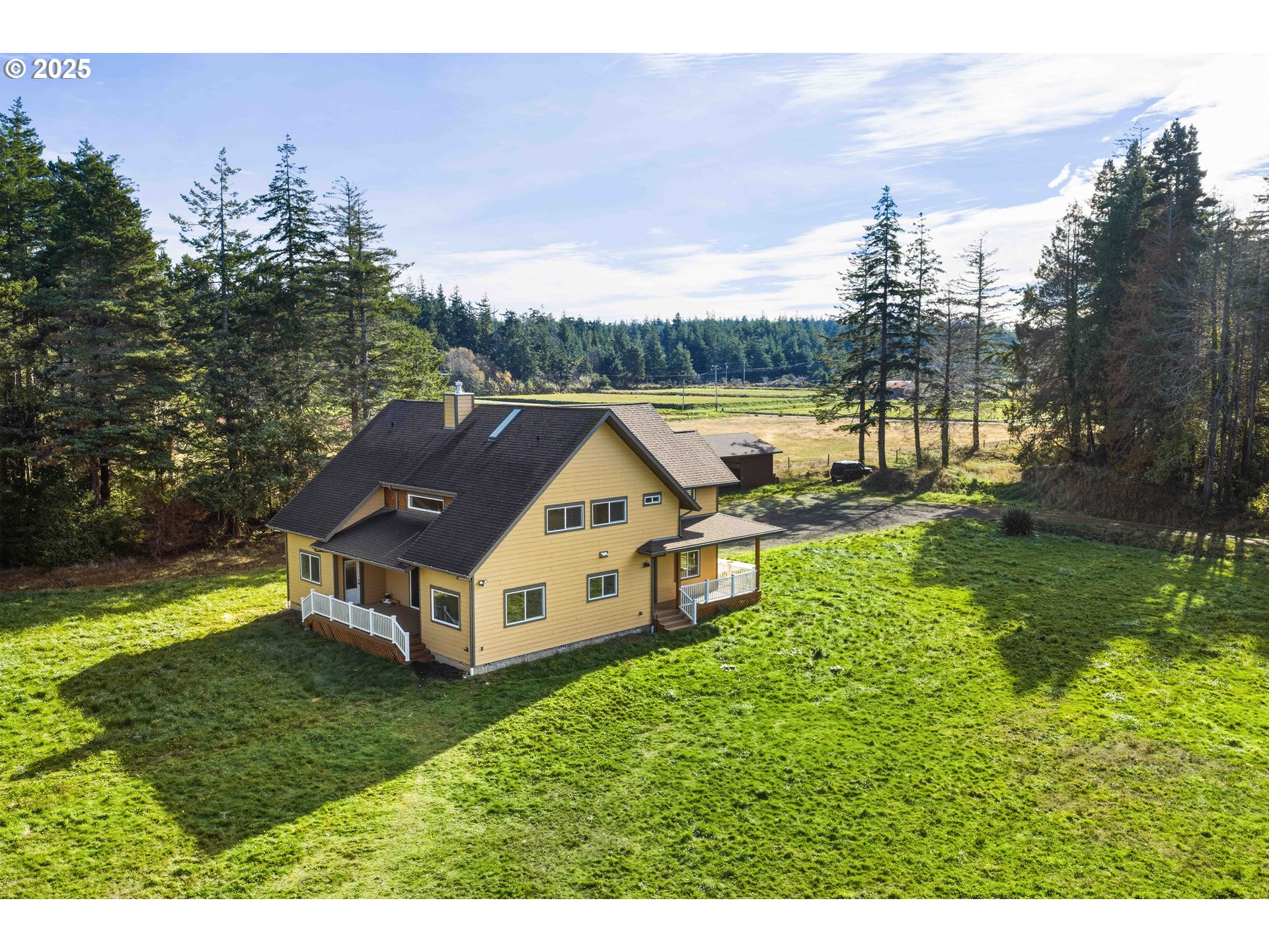 55942 Lost Valley Road Bandon, OR 97411 - Photo 41 of 48 a aerial view of a house with a yard