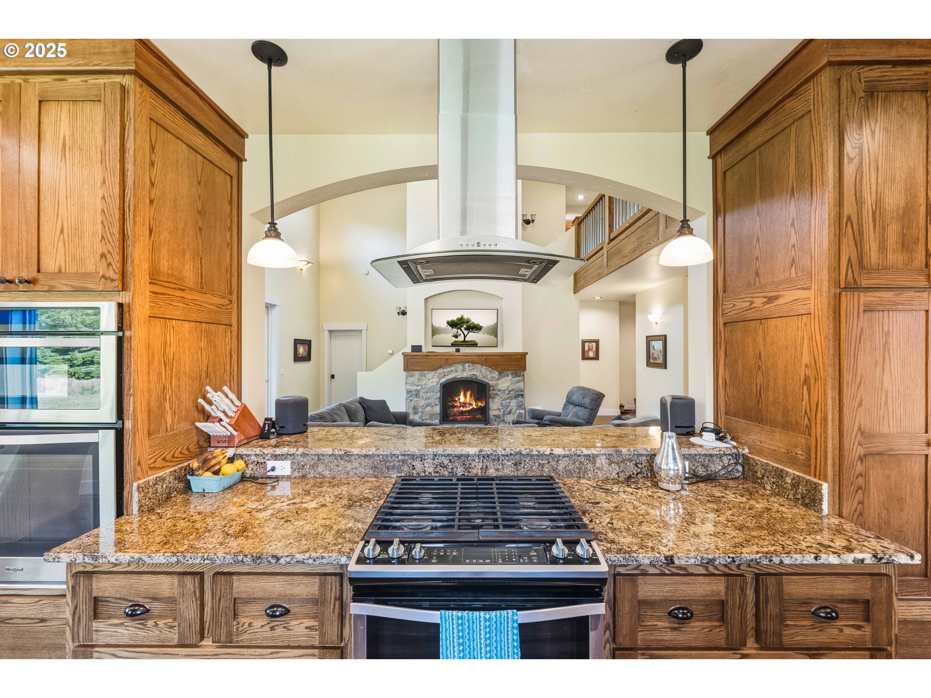 55942 Lost Valley Road Bandon, OR 97411 - Photo 7 of 48 a kitchen with stainless steel appliances granite countertop a stove and a refrigerator