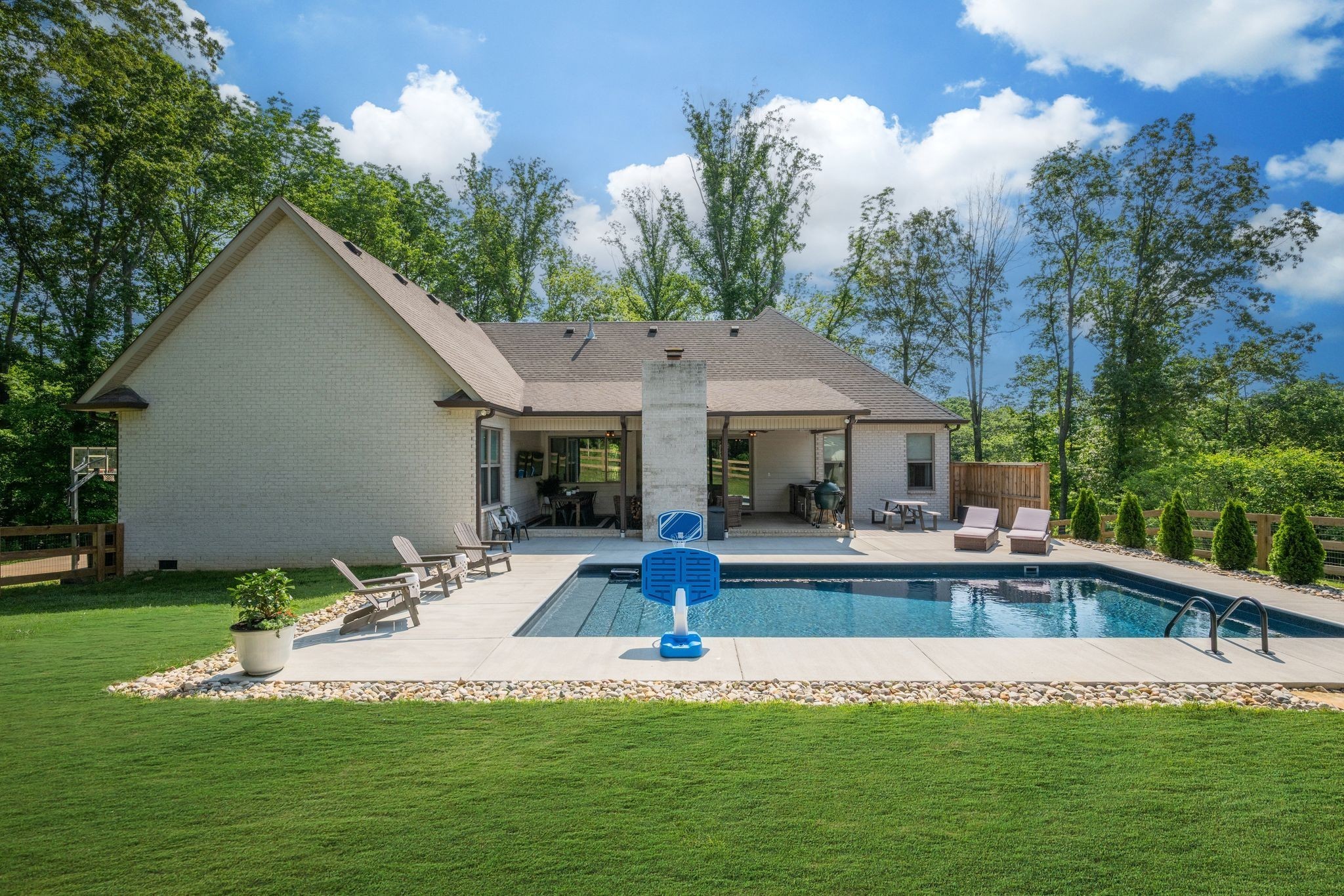 1092 Meeks Cemetery Road Burns, TN 37029 - Photo 45 of 61 a view of swimming pool with lawn chairs and large trees