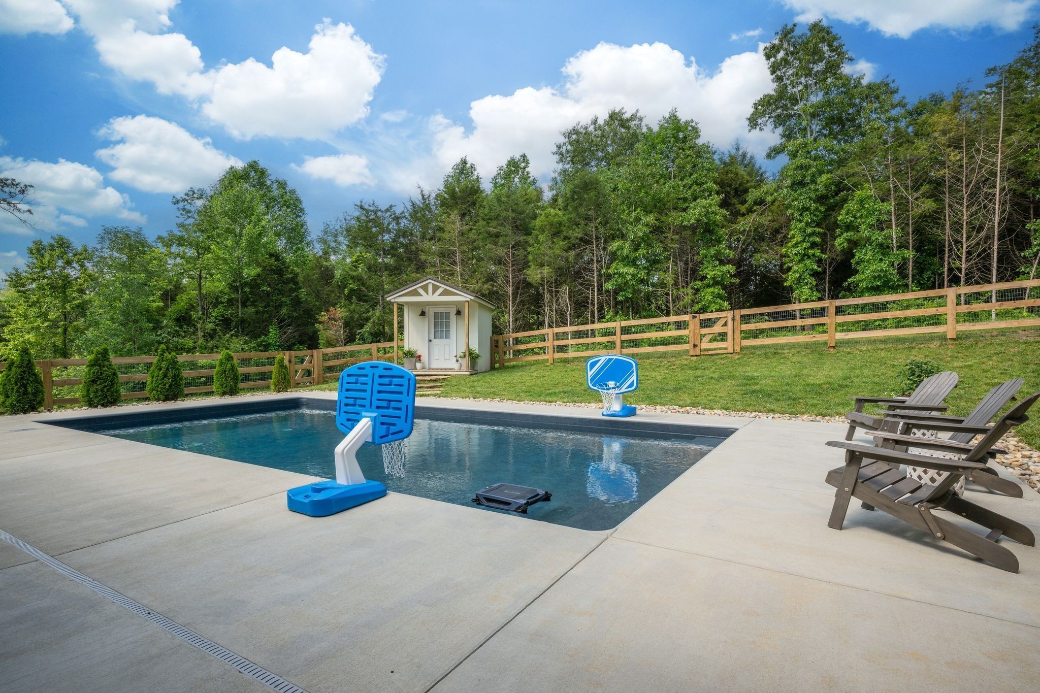 1092 Meeks Cemetery Road Burns, TN 37029 - Photo 6 of 61 a view of a swimming pool with a lounge chair and a small yard