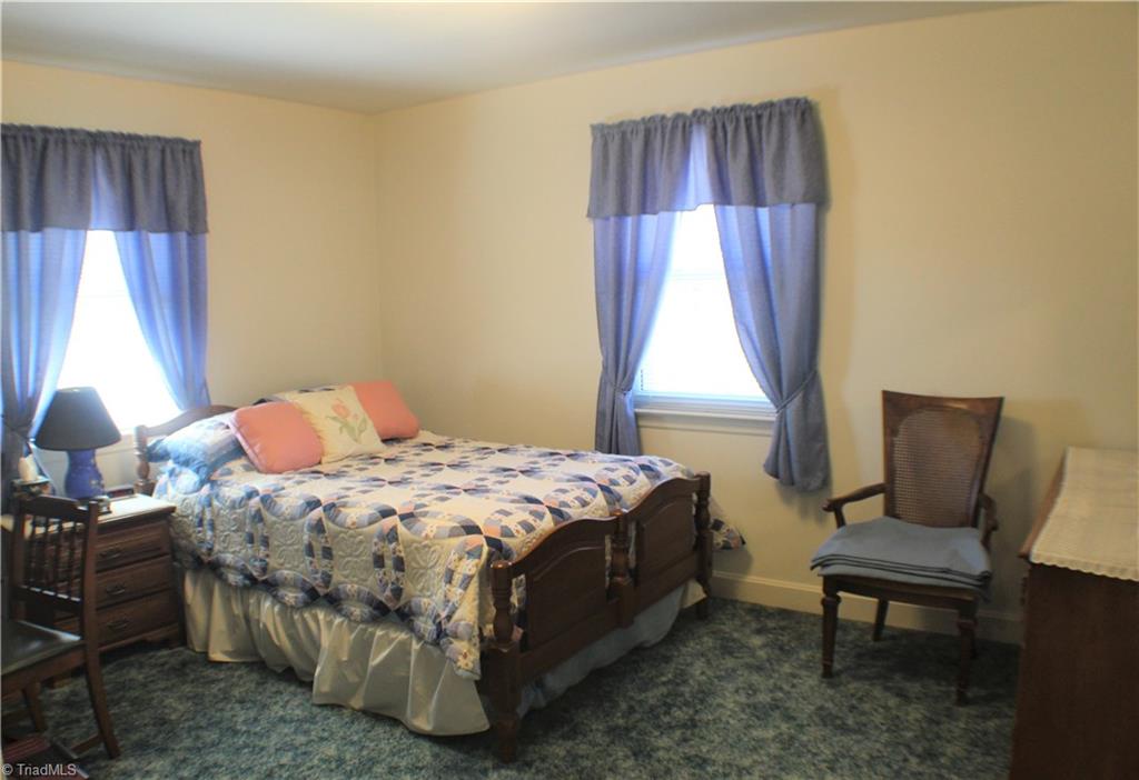 330 Oak Summit Road Winston-Salem, NC 27105 - Photo 10 of 17 Bedroom 3 all bedrooms have hardwood floors underneath carpet.