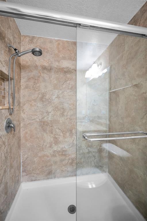 5064 Royal Palms Way, Unit 204 New Port Richey, FL 34652 - Photo 23 of 89 a bathroom with a shower
