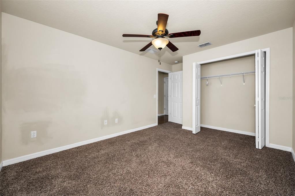 5064 Royal Palms Way, Unit 204 New Port Richey, FL 34652 - Photo 31 of 89 a view of room with a ceiling fan
