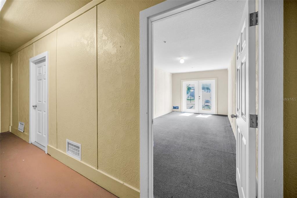 5064 Royal Palms Way, Unit 204 New Port Richey, FL 34652 - Photo 37 of 89 a view of a hallway with wooden floor and windows