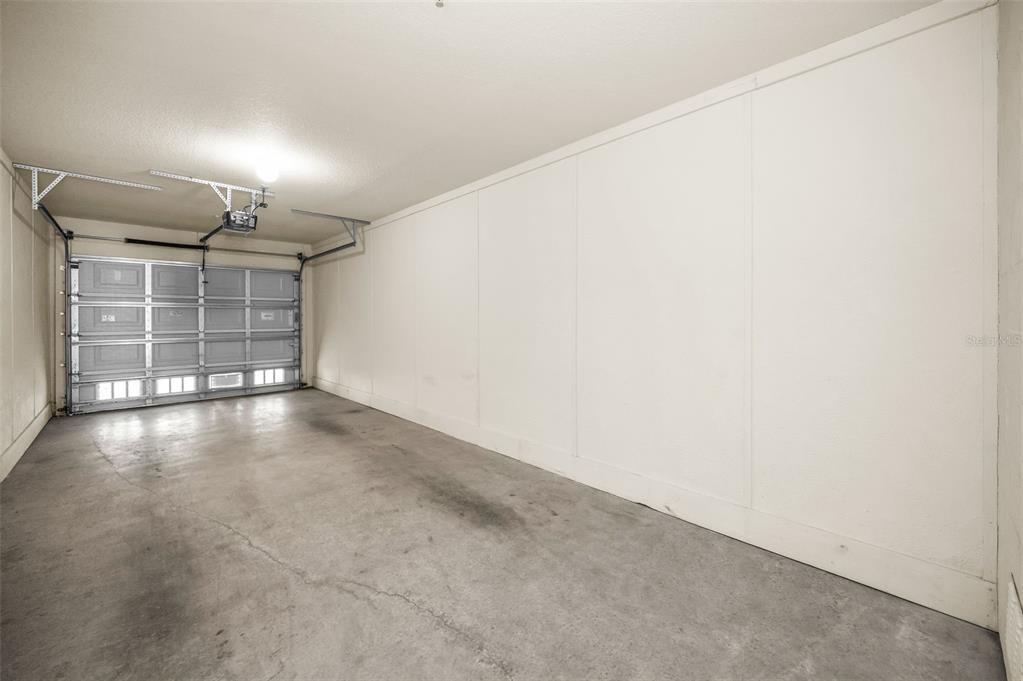 5064 Royal Palms Way, Unit 204 New Port Richey, FL 34652 - Photo 42 of 89 an empty room with a empty space and windows