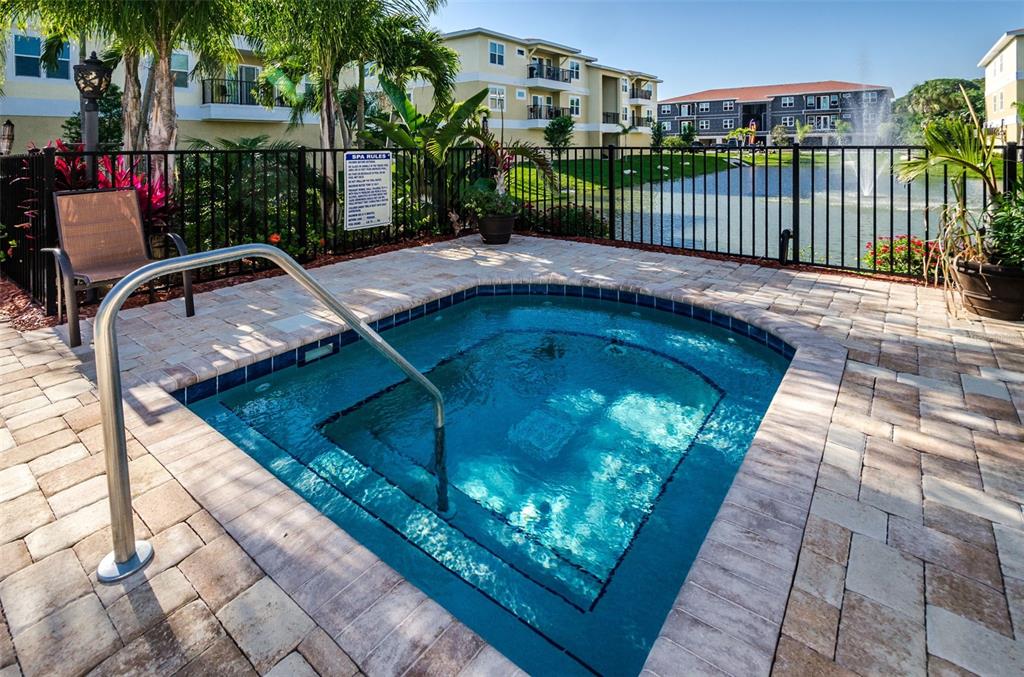 5064 Royal Palms Way, Unit 204 New Port Richey, FL 34652 - Photo 55 of 89 a balcony with next to a yard