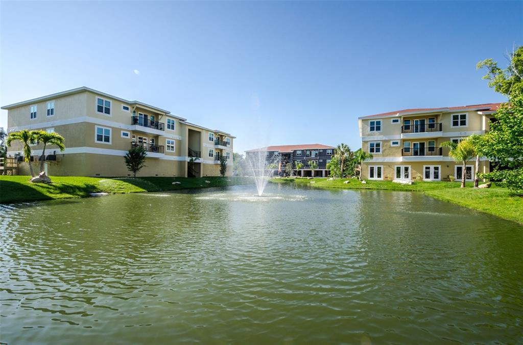 5064 Royal Palms Way, Unit 204 New Port Richey, FL 34652 - Photo 64 of 89 a view of building with river in front of it