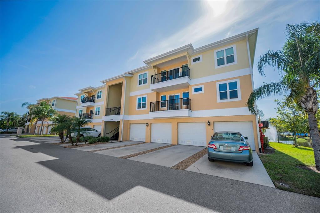 5064 Royal Palms Way, Unit 204 New Port Richey, FL 34652 - Photo 71 of 89 a car parked in front of a house