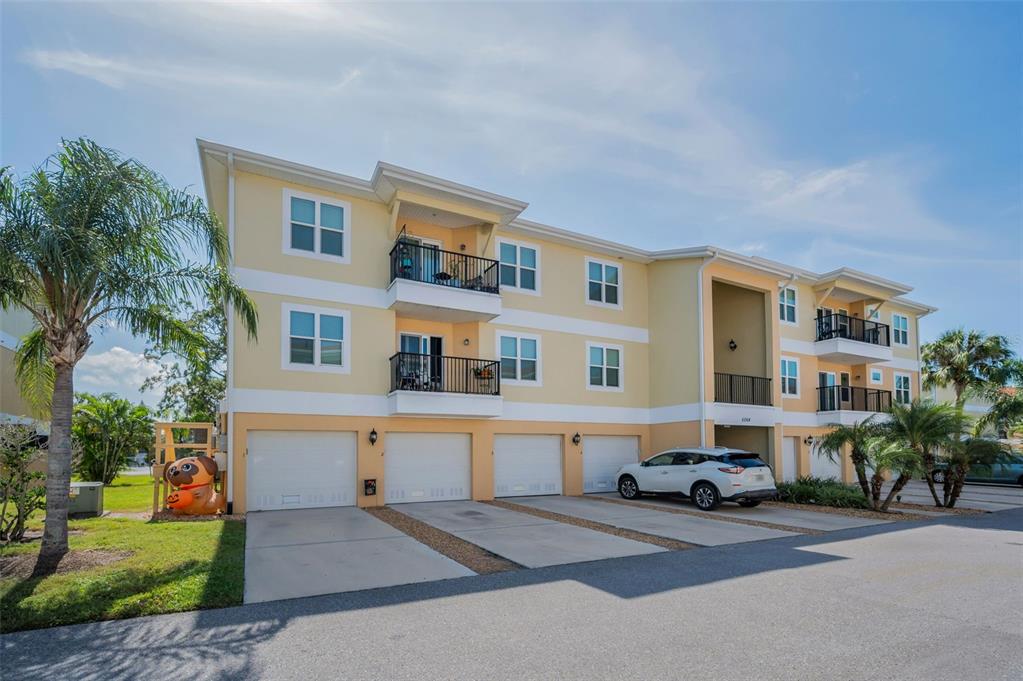 5064 Royal Palms Way, Unit 204 New Port Richey, FL 34652 - Photo 85 of 89 a car parked in front of a house