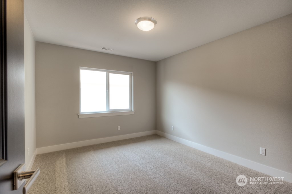 2010 228th Place Southwest, Unit 49 Bothell, WA 98021 - Photo 8 of 25 an empty room with a window