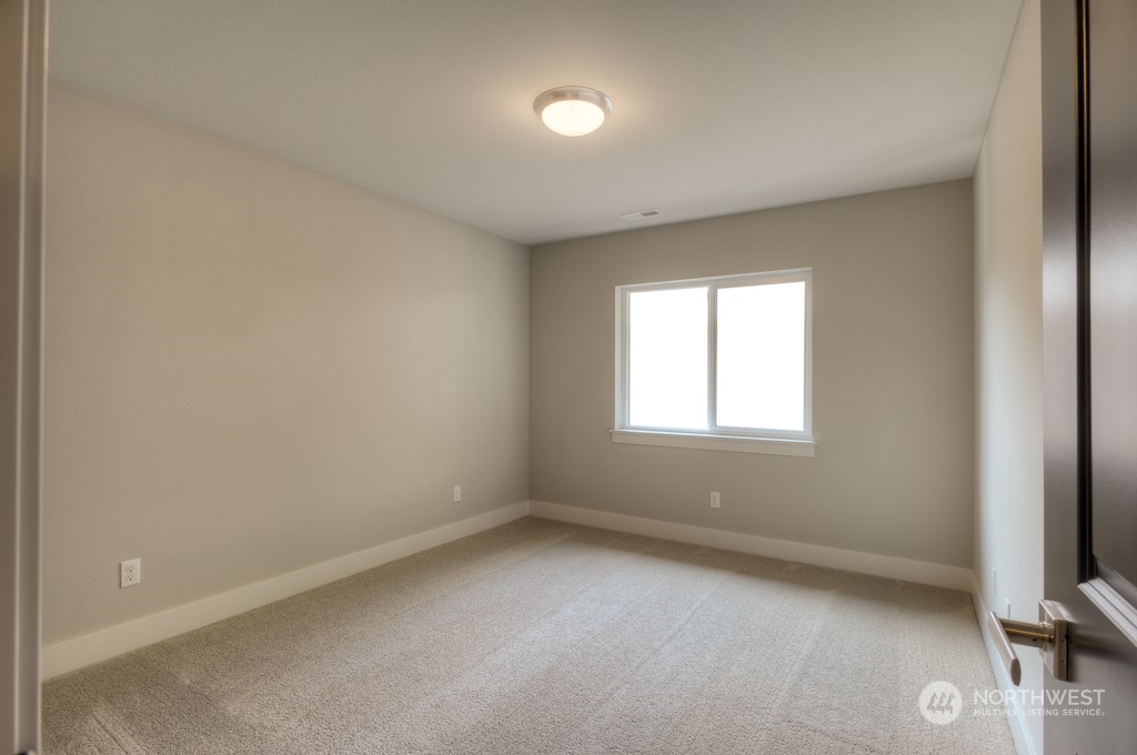 2010 228th Place Southwest, Unit 49 Bothell, WA 98021 - Photo 9 of 25 an empty room with a window