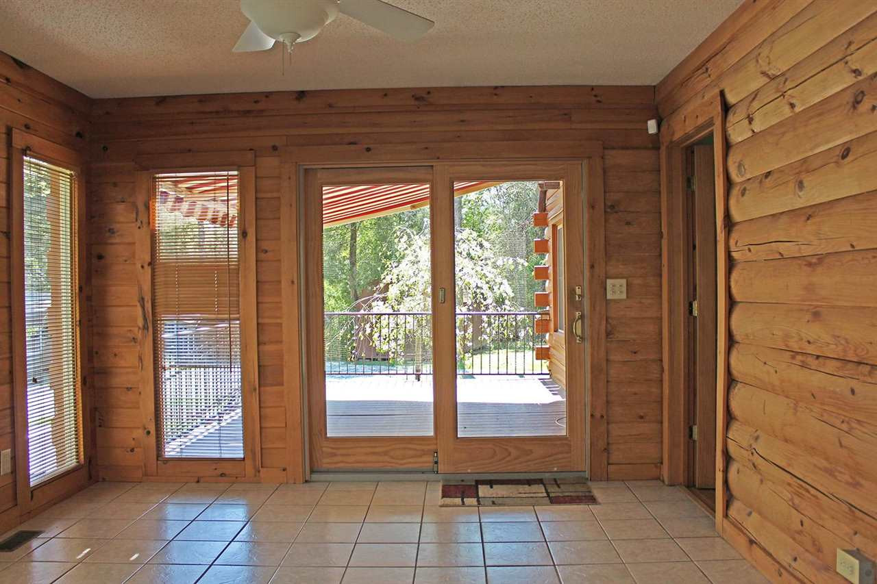 5214 Gray Road Timberlake, NC 27583 - Photo 10 of 30 view of sunroom and deck