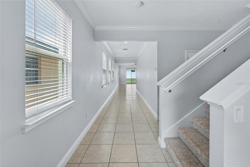 6687 Alder Road Harmony, FL 34773 - Photo 19 of 42 a view of a hallway with windows