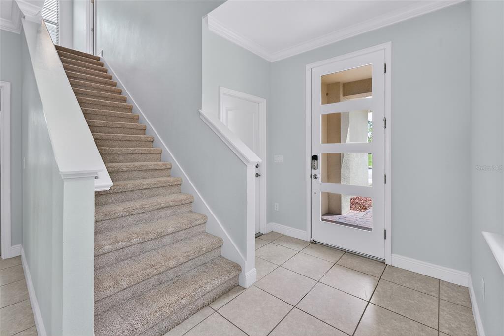 6687 Alder Road Harmony, FL 34773 - Photo 20 of 42 a view of entryway and hall with wooden floor