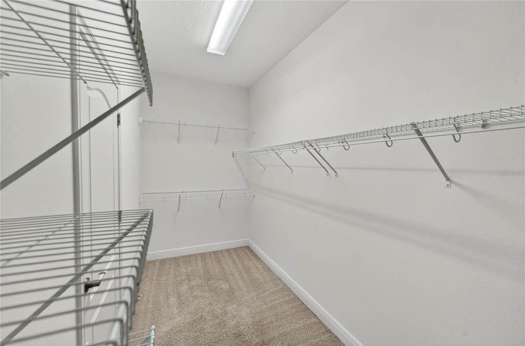 6687 Alder Road Harmony, FL 34773 - Photo 24 of 42 a view of a room with racks on the wall