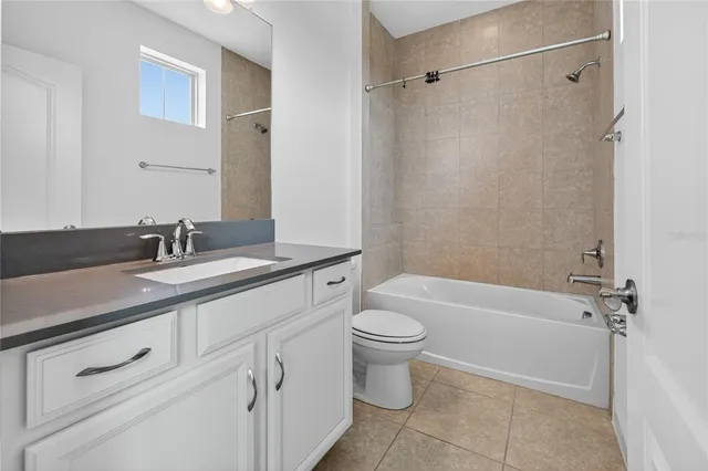 a bathroom with a sink vanity and a mirror