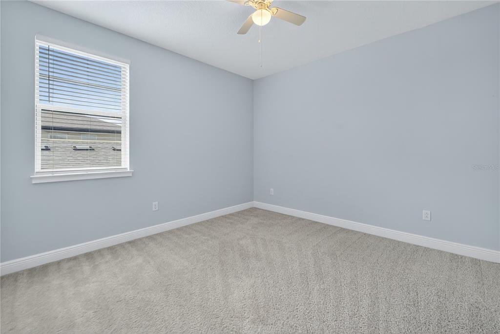 6687 Alder Road Harmony, FL 34773 - Photo 34 of 42 an empty room with a window